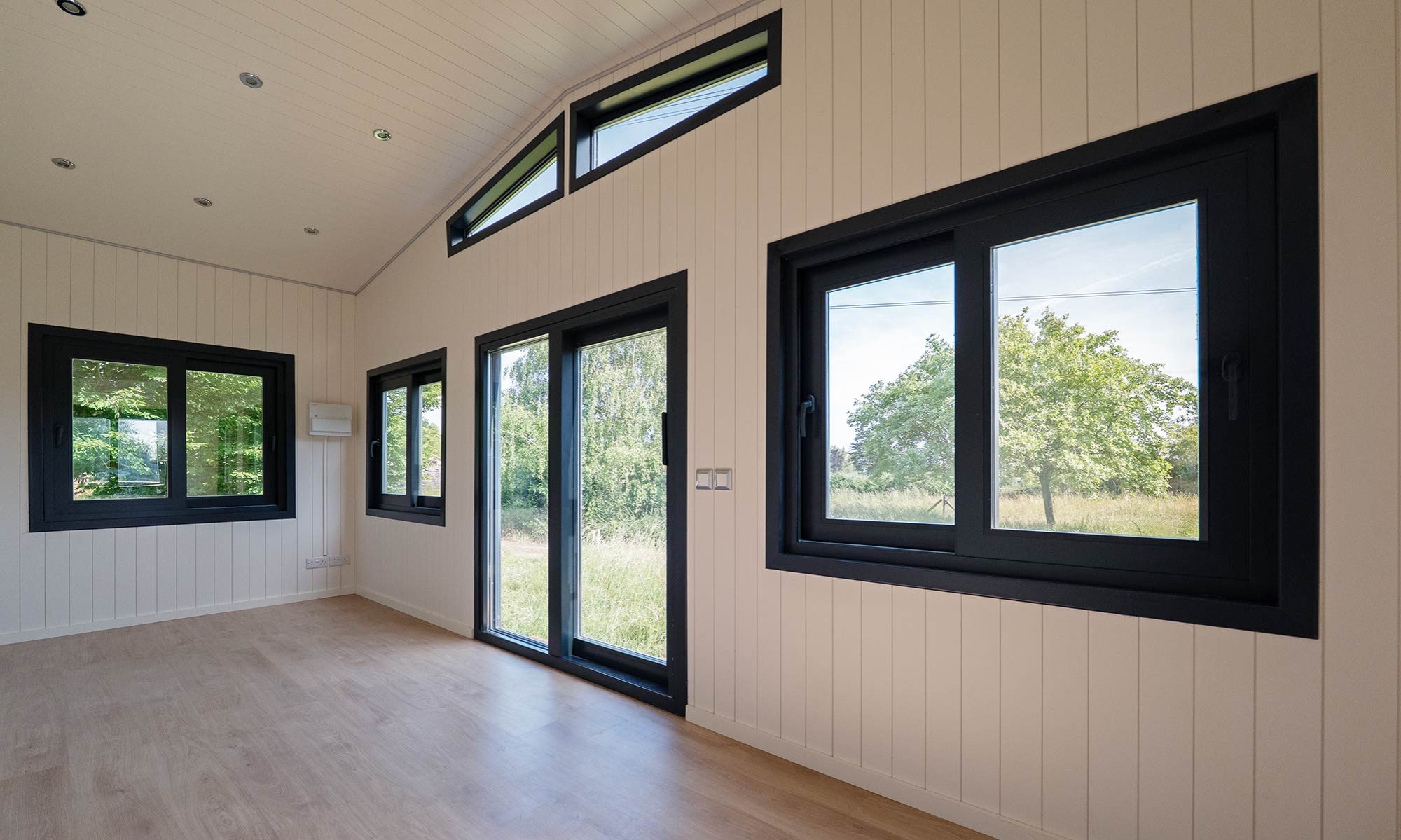 A room filled with natural light overlooking trees